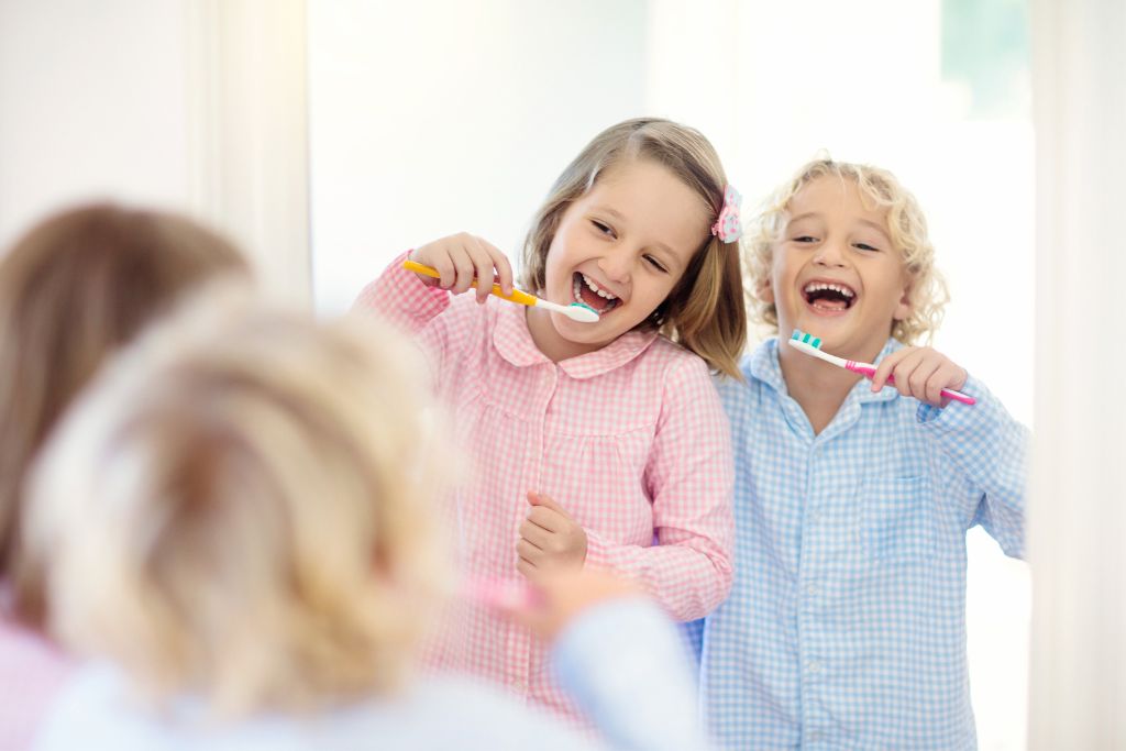 children brushing and flossing